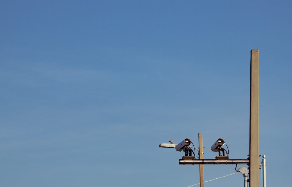 A pair of automated license plate reader cameras mounted on a pole